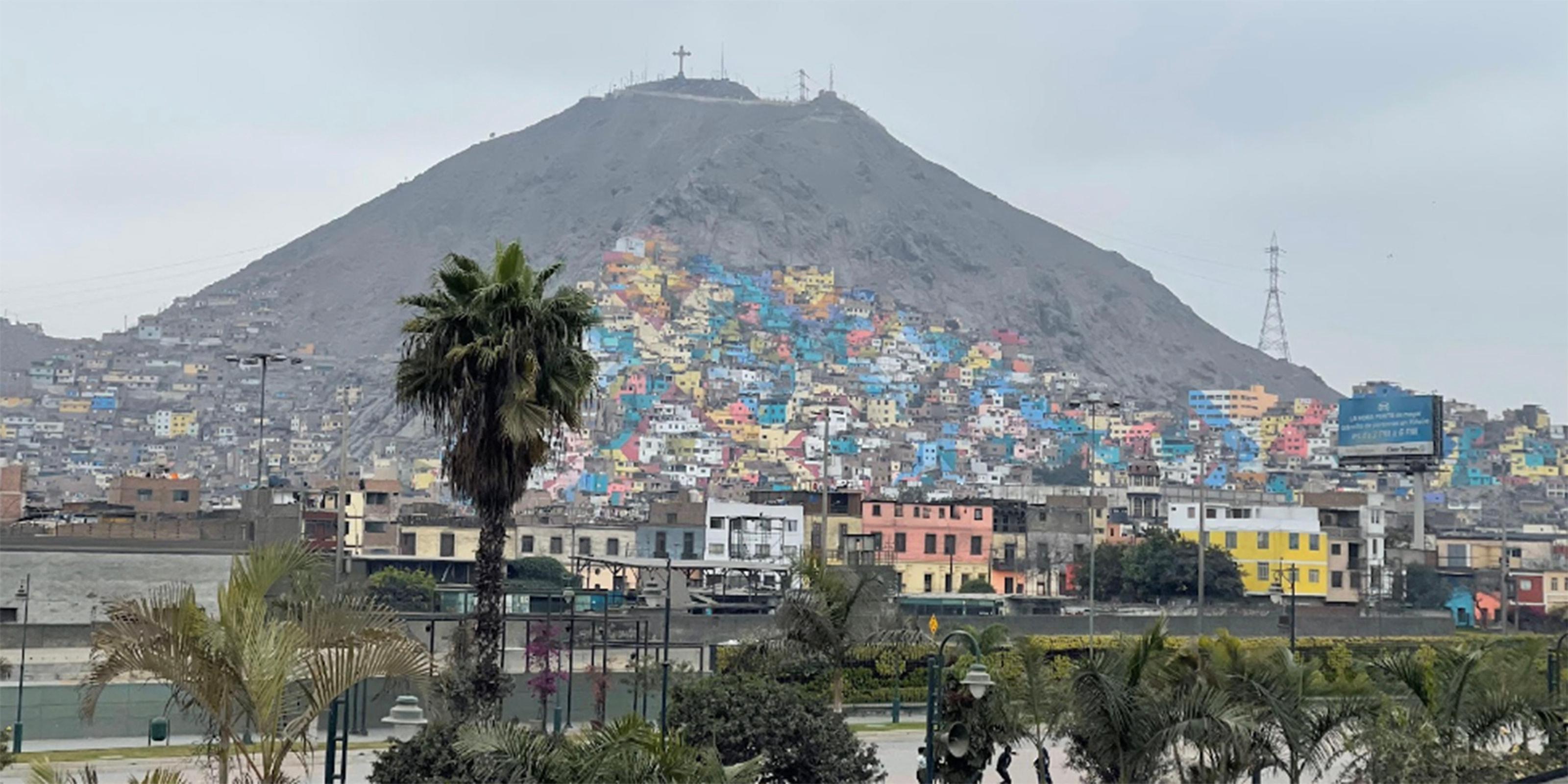 Picture of community with homes built into the side of the hill.