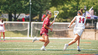 Bonnie Yu, Saint Joseph's lacrosse player, on field against opponent