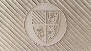 The SJU seal inside Post Crossing.