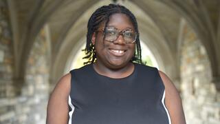 Headshot of Faith Adedokun outside
