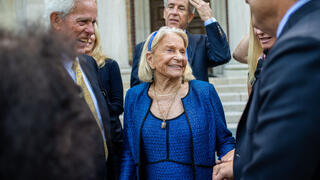 Frances Maguire speaking to guests outside the museum