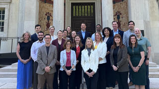 Participants in the inaugural Self-Aware Leader (SAL) program gather with President Cheryl A. McConnell, PhD, in front of the Frances M. Maguire Art Museum following their final project presentations on May 19, 2025.