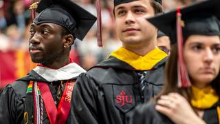 Three graduates in regalia