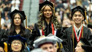 Three graduates in regalia