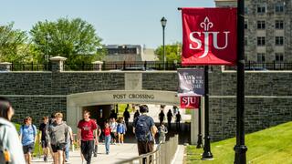 Students walking through Post Crossing between classes.