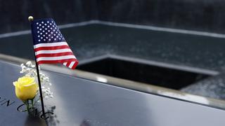 A single yellow rose placed on the memorial pool at ground zero in lower Manhattan.