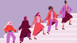 A diverse group of women holding hands and walking up step for Women's History Month