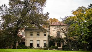 The Barnes' beautiful architecture peeks through the surround trees and foliage