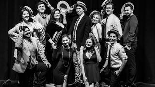 The cast of "Company" poses in a vaudeville pose with boater hats.