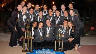 SJU Dance Team group photo wearing championship medals for Division 1 title