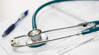 stethoscope and pen