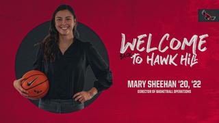 Mary Sheehan, Saint Joseph's Director of Basketball Operations, smiling holding ball