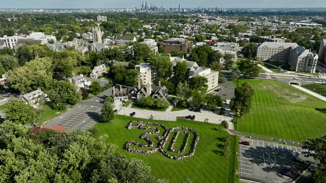 Aerial photo of students standing in a "30" formation