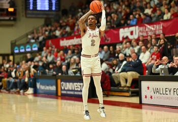 Erik Reynolds throwing basketball on court