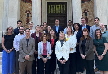 Participants in the inaugural Self-Aware Leader (SAL) program gather with President Cheryl A. McConnell, PhD, in front of the Frances M. Maguire Art Museum following their final project presentations on May 19, 2025.