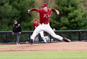 Saint Joseph's Colton Book on the field throwing the baseball