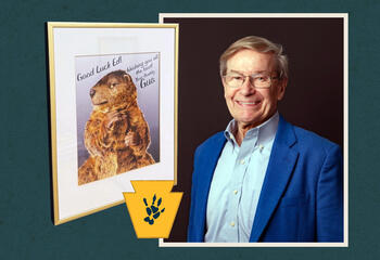 Ed Mahlman, BA ’69, with a portrait of Gus the Groundhog