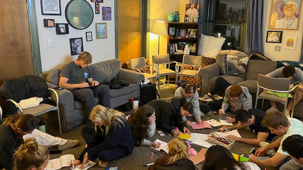 Students making cards for patients in a children's hospital.