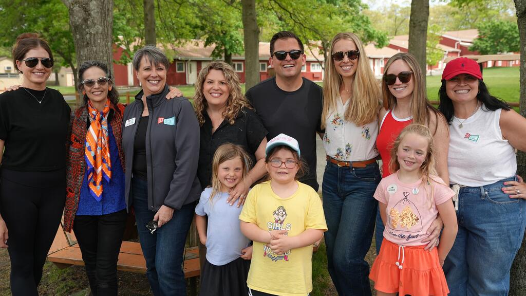 Holly and Ryan (center left and right) alongside members of The Balance Project and their partner organization, Let Grow.