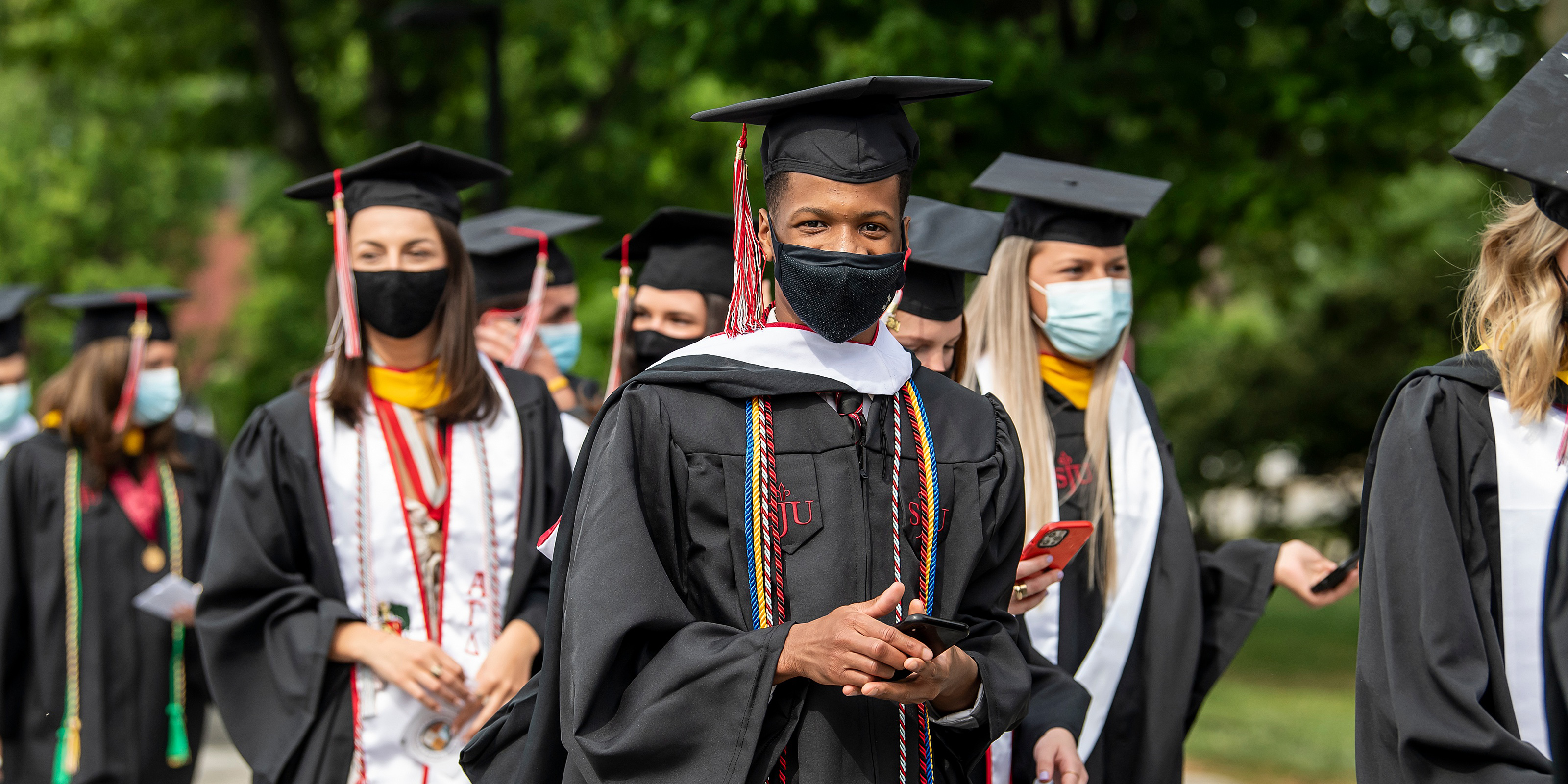 Graduates and Loved Ones Celebrate Commencement On Hawk Hill Saint