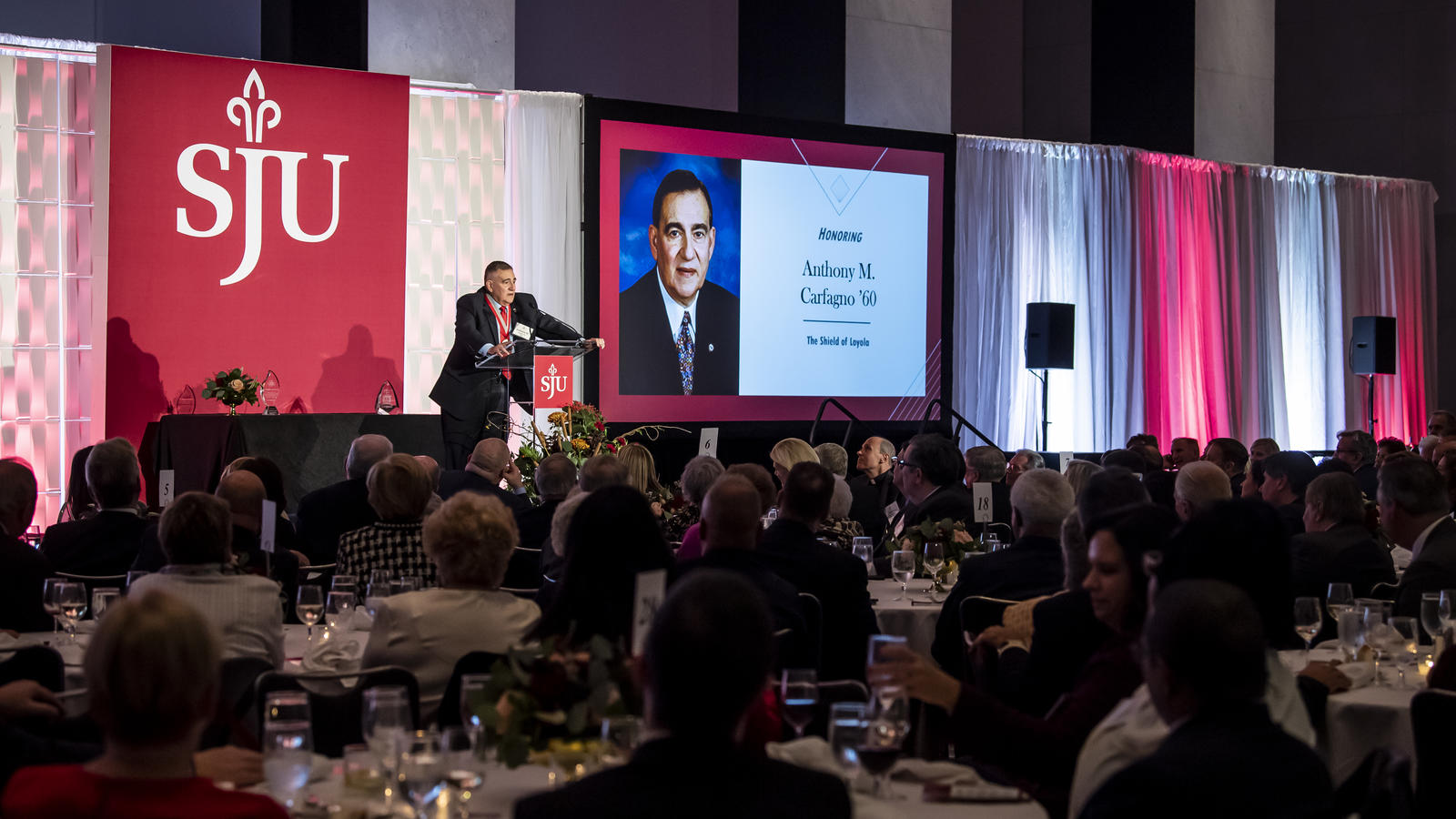 Carfagno speaks at a podium