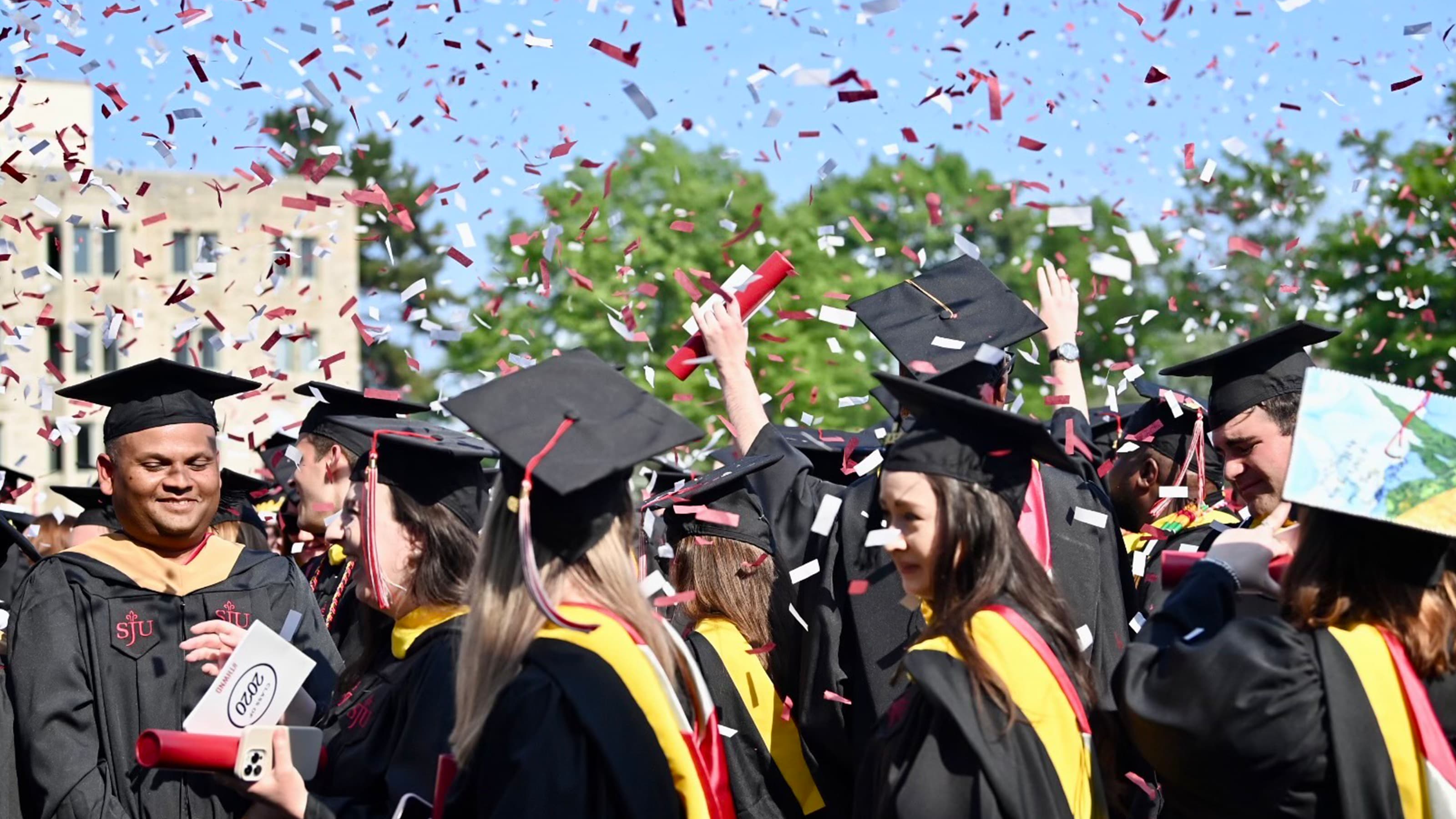 Graduates under confetti