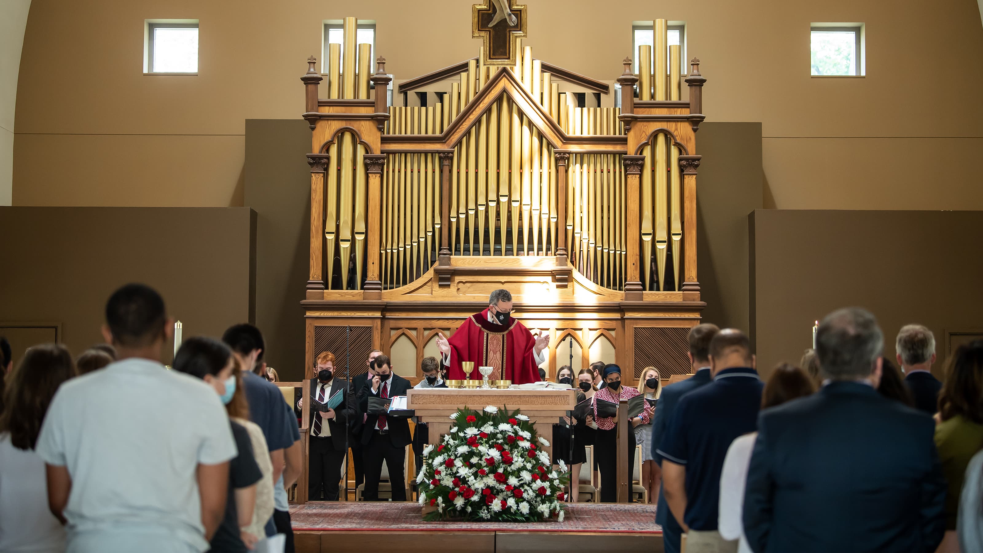 Mass of the Holy Spirit. Father Dan Joyce stands at the alter in front of the organ