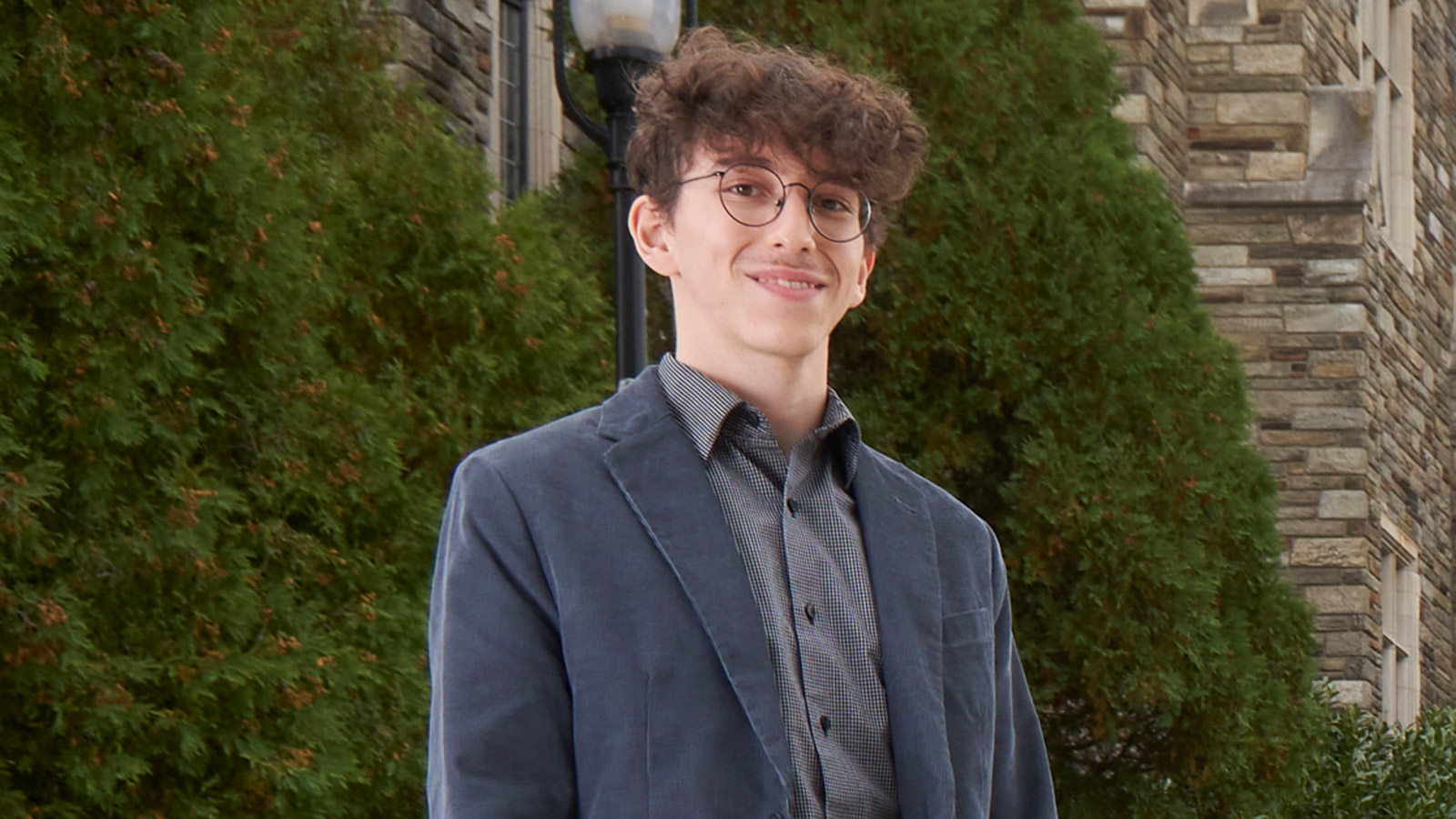 Alex Manduca '22, a physics major at Saint Joseph's University, wearing a suit