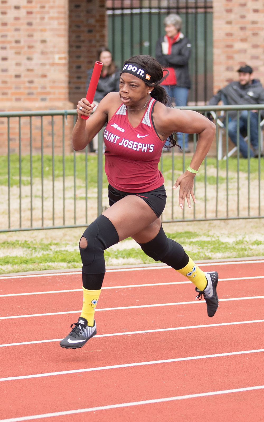 saint joseph's university female track student running