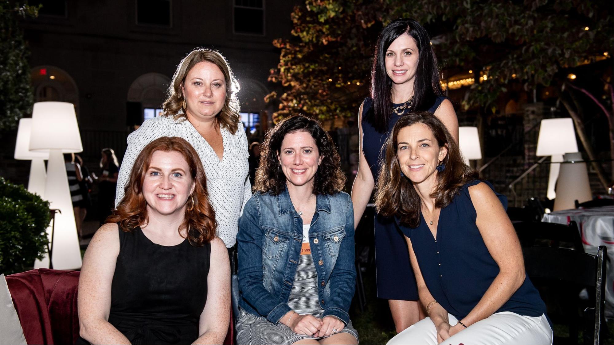 Five female alumnae gather at the 2019 Hawkfest reunion