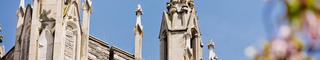 The spires on top of Barbelin against a blue sky