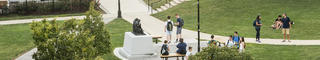 students walking in front of chapel.