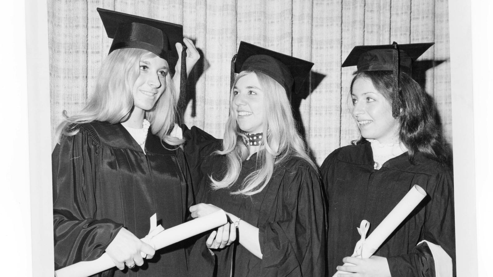 three women in caps and gowns in 1971