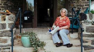 maria kefalas sitting on her porch