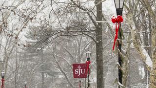 Snow falling on Saint Joseph's University Campus