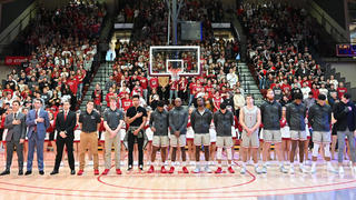 saint joseph's university student athletes standing in basketball court