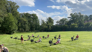 Participants in an outdoor rowing class
