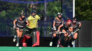 Five members of the Saint Joseph's field hockey team defend the goal