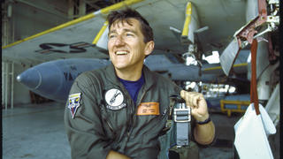 John Lehman '64 beside an attack plane