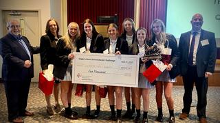 Students at Gwynedd Mercy pose with an oversized check
