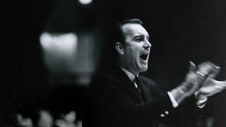 Jack McKinney '57 coaching the Hawks from the sideline