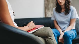 woman talking to a female counselor