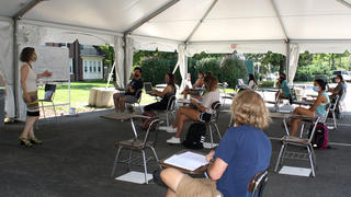 Students in the outdoor classroom near Claver House.