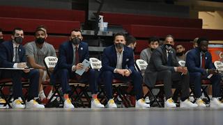 Saint Joseph’s University men’s basketball coaches on the sideline wear sneakers with gold laces for Coaches Vs. Cancer.