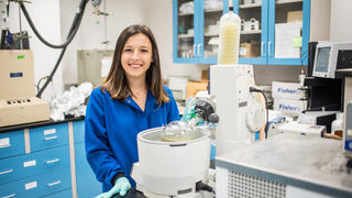 A photo of Elise Brutschea in her laboratory