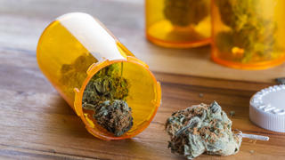 pill bottle with marijuana in it