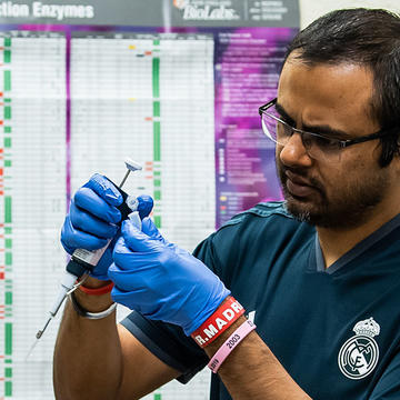 Professor with student reviewing the result of a experiment