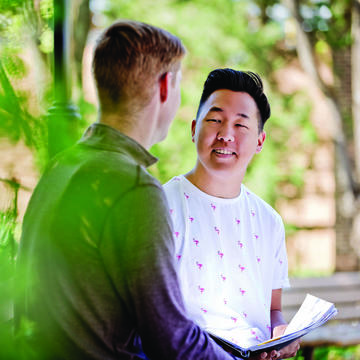 Two students outside talking at Saint Joseph's University