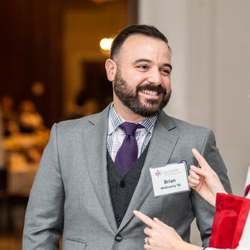 Elizabeth Convery '05 talking with Saint Joseph's University alum at networking event