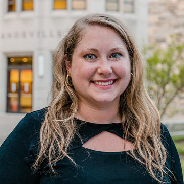 Saint Joseph's University Haub MBA student standing in front of Mandeville Hall on campus.